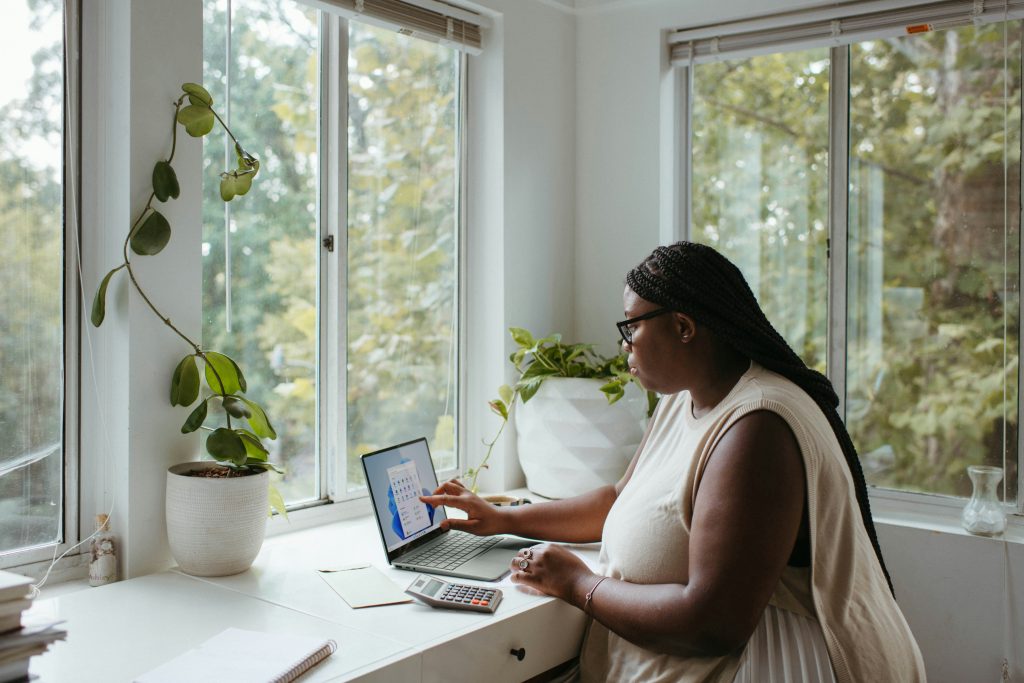 Remote worker at a laptop, preparing a Digital Nomad Visa application